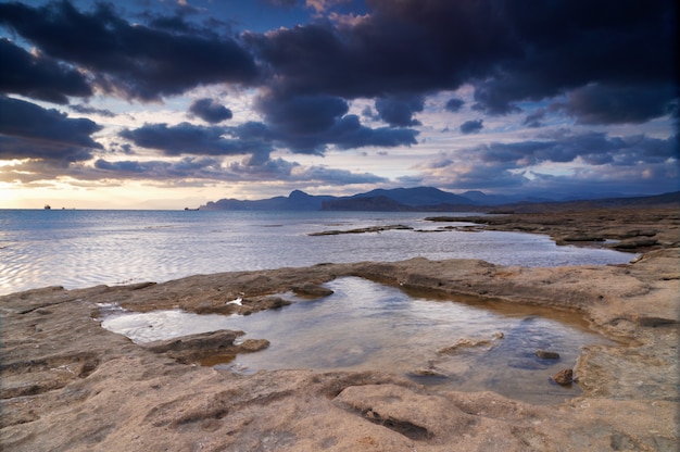 Colorful summer seascape. rocky coast at sunset