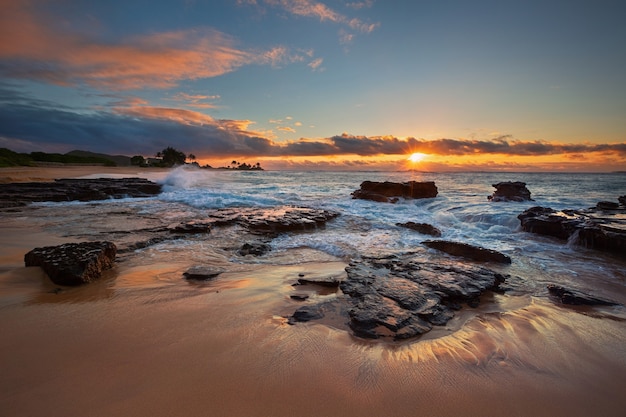 Colorful sunrise from Sandy Beach, Oahu, Hawaii USA