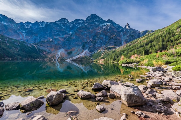 Colorful sunrise at lake in the Tatra Mountains in autumn