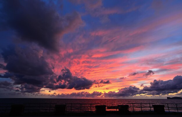 Colorful sunset in Alghero seafront Italy