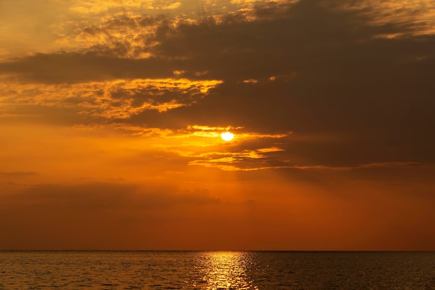 Colorful sunset over calm sea water near tropical beach Summer vacation concept Island Koh Phangan Thailand