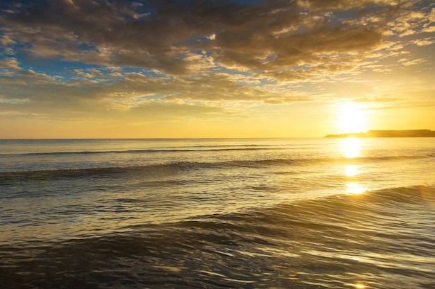 Colorful sunset over ocean on tropical island