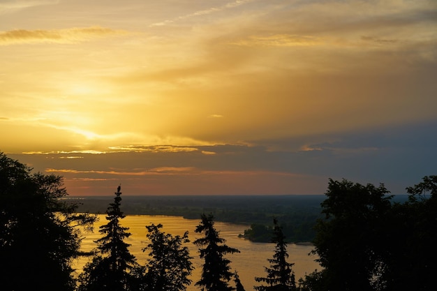 Colorful sunset sky over the river in the golden hour