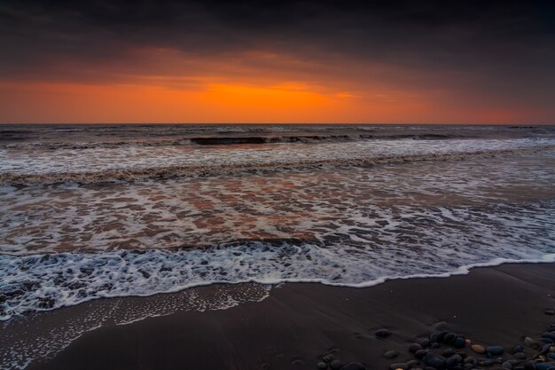 Colorful sunset sky over the sea beach