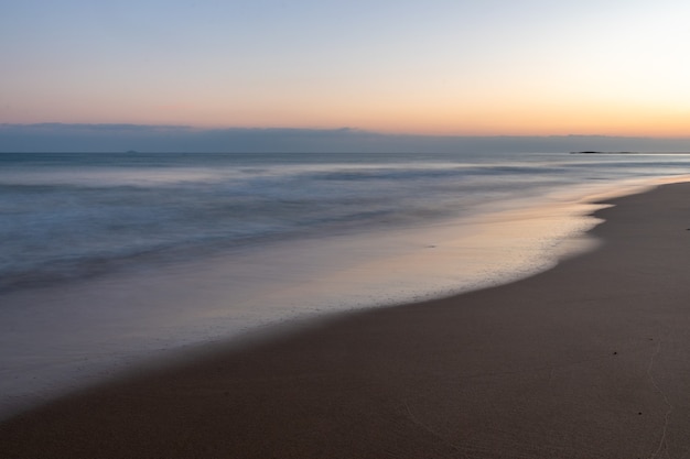 Colorful sunset sky and sea with blurred motion.