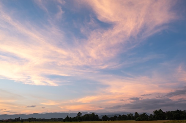 Colorful sunset and sunrise with clouds Blue and orange color of nature Many white clouds in the blue sky The weather is clear today sunset in the clouds The sky is twilight