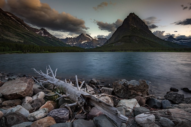 Colorful sunset over Swiftcurrent Lake in Glacier National Park, Montana.