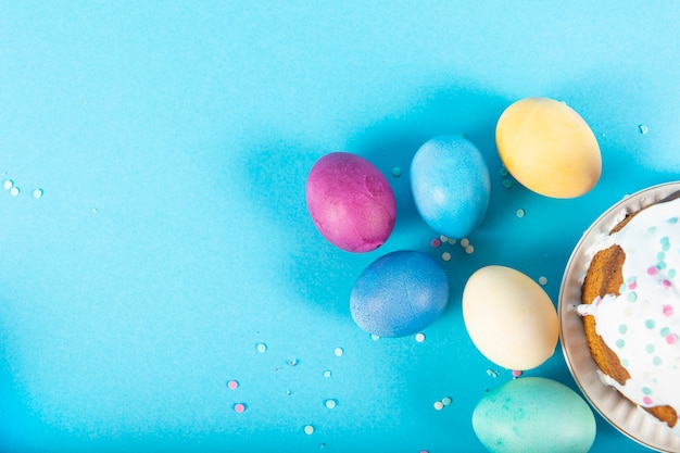 Colorful surface with Easter eggs on blue surface