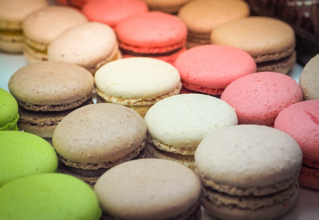 Colorful tasty macaroons in a row. 