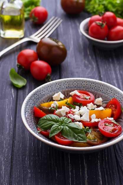 Colorful tomatoes salad with feta cheese