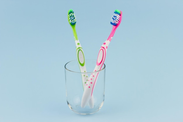 Colorful toothbrushes in a glass