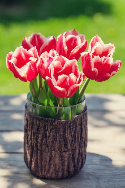 Colorful tulips on garden table