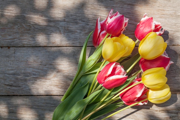 Colorful tulips on garden table