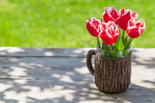 Colorful tulips on garden table