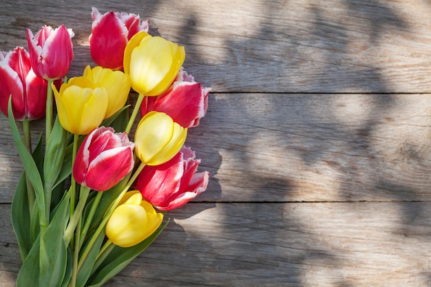 Colorful tulips on garden table