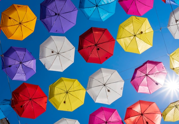 Colorful umbrellas background Colorful umbrellas in the sky Street decoration