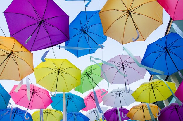 Colorful umbrellas decoration on the clear sky background