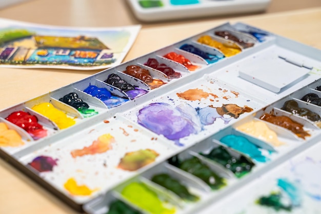 Colorful of watercolor tray background with watercolor set Selective focus