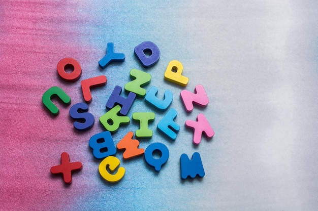 Colorful wooden letters on a white background