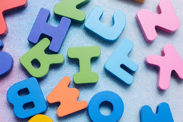 Colorful wooden letters on a white background