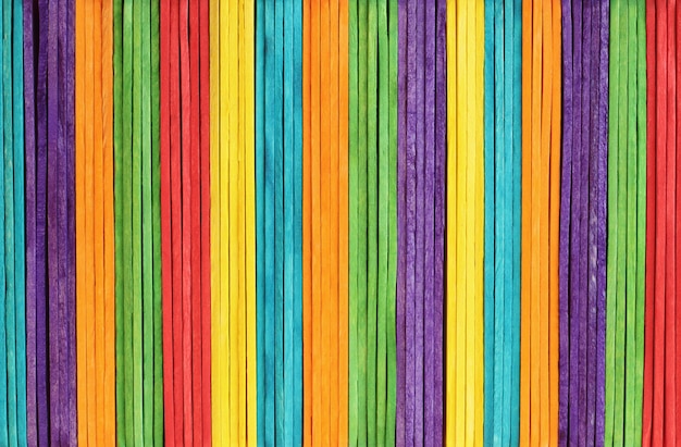 Colorful wooden wall texture in bright rainbow colors