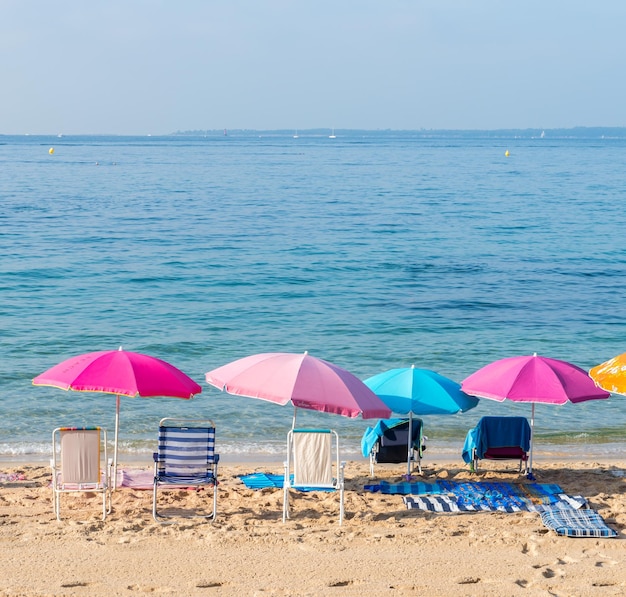 Colourful beach umbrellas and chairs in Juan les Pins France