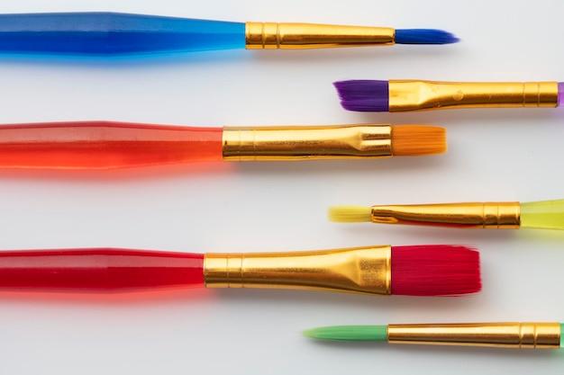 Colourful creative paintbrush art supply background