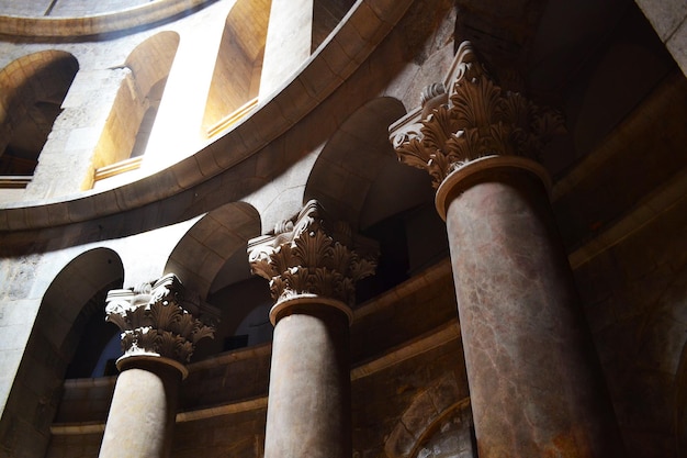 The columns illuminated by the light in the temple of the Holy Sepulchre in Jerusalem Israel