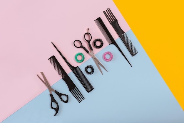 Combs and hairdresser tools on color background top view. Copy space. Flat lay. Still life. Mock-up