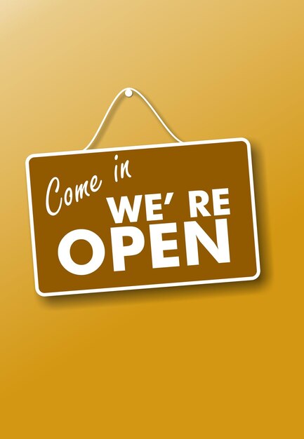 Photo come in we re open text sign on yellow background