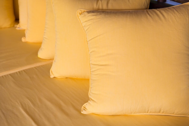 comfort, leisure and interior decoration concept - couch with pillows at hotel