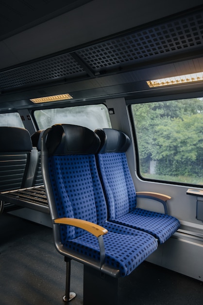 Comfortable and beautiful blue seats in the train. Transport. Travels.