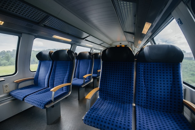 Comfortable and beautiful blue seats in the train. Transport. Travels.