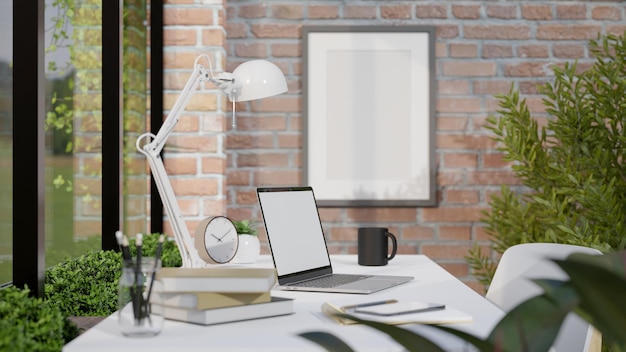 Comfortable minimal workspace in the office with laptop mockup on the table against the brick wall