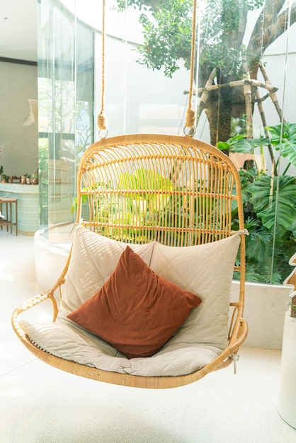 comfortable pillow on wicker or rattan swing chair