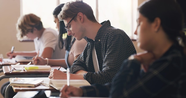 An A coming right up Shot of teenagers writing an exam in a classroom