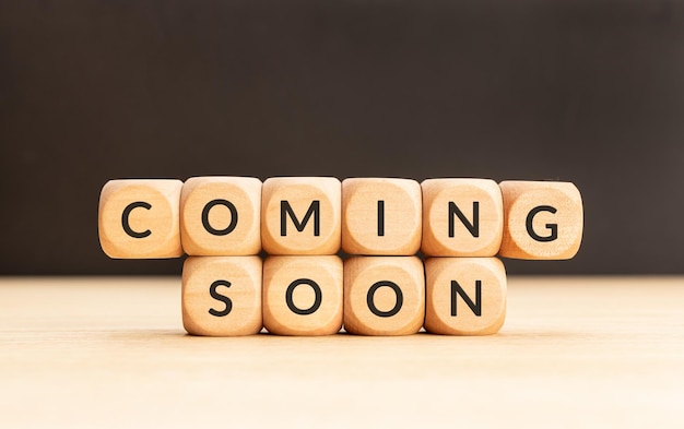 Coming soon phrase on wooden blocks