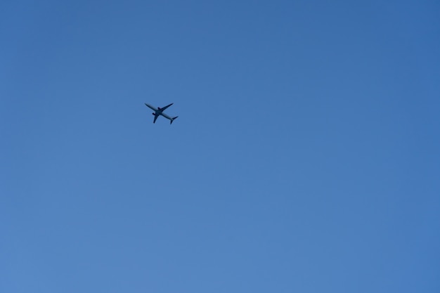 Commercial plane fly on the blue sky