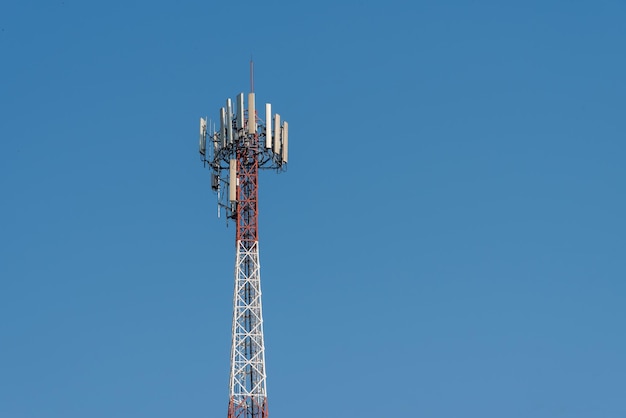 Communication tower on blue sky background