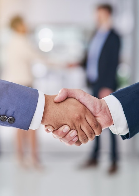 Company collaborations Shot of businesspeople shaking hands