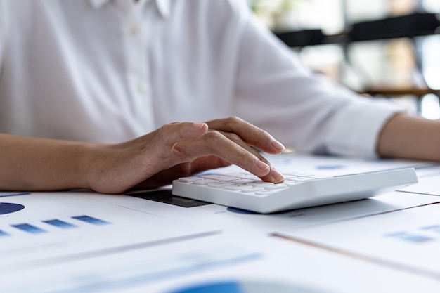 The company's finance manager is using a calculator, he uses a calculator to calculate the numbers in the company's financial documents that employees in the department create as meeting documents.