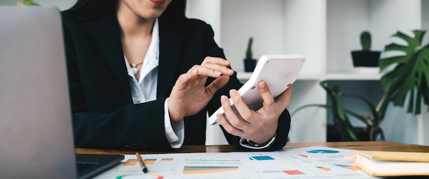 The company's finance manager is using a calculator he uses a calculator to calculate the numbers in the company's financial documents that employees in the department create as meeting documentsxA