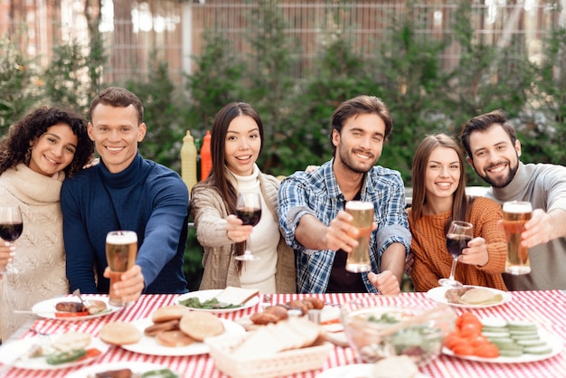 A company of young people came together for a barbecue.