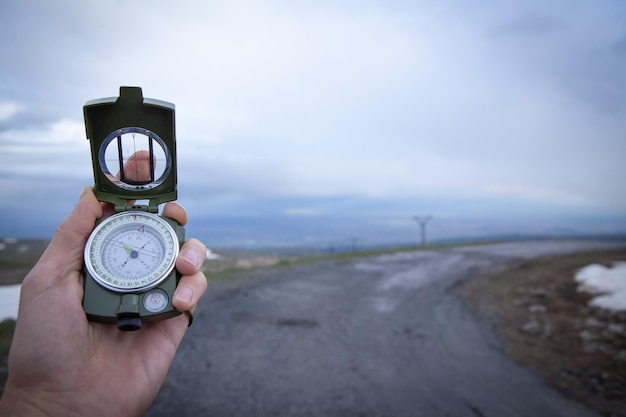 Compass in hand find way destination