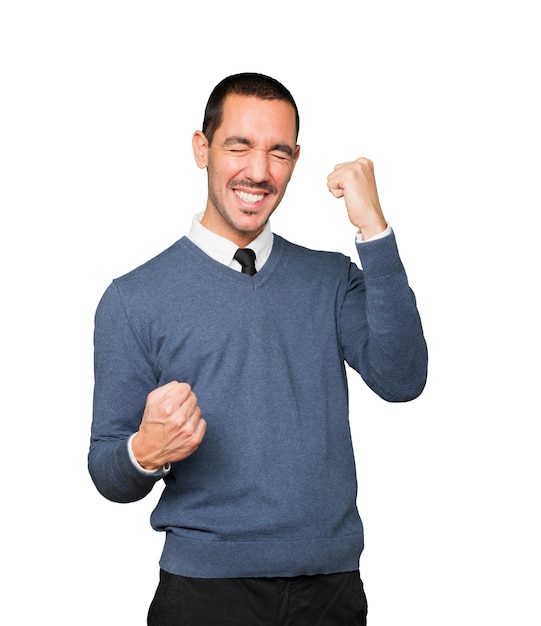 Competitive young man making a gesture of celebration