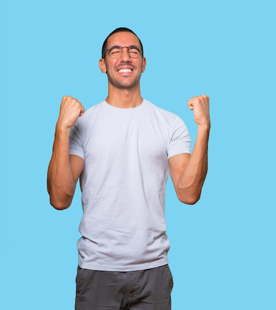 Competitive young man making a gesture of celebration