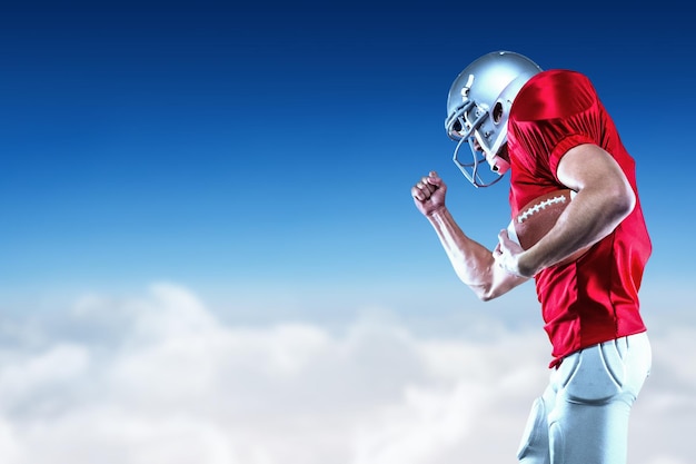 Composite image of american football player in midair