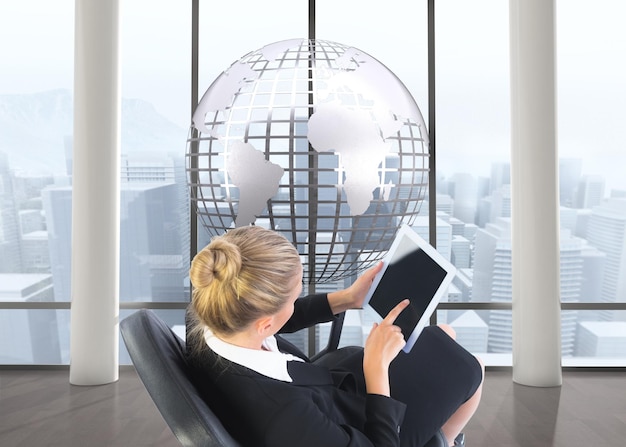 Composite image of blonde businesswoman sitting on swivel chair with tablet