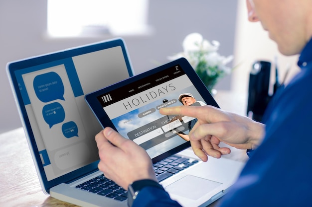 Composite image of businessman using tablet computer in office