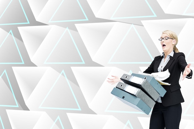 Composite image of businesswoman dropping many folders